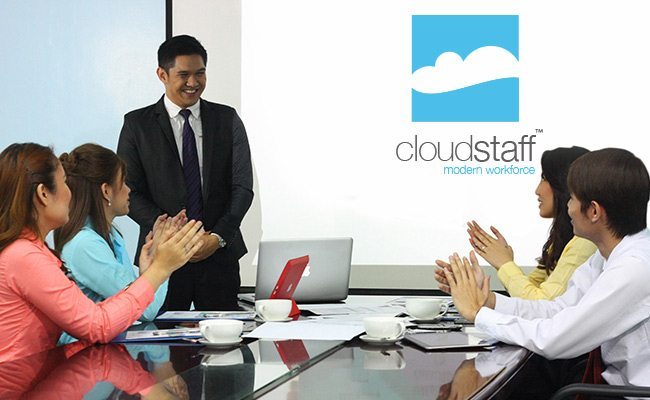 Career planning. A man being congratulated by people for a job well done on his presentation