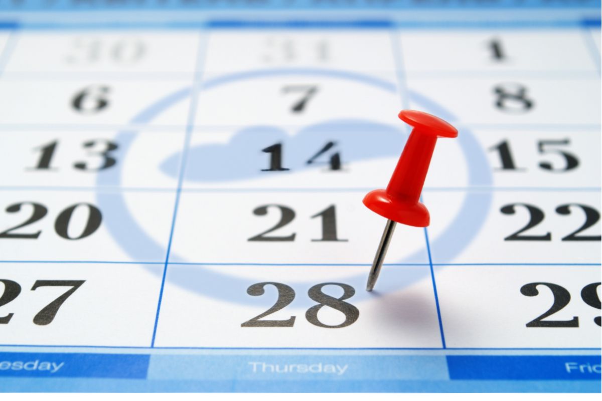 A calendar with a red push pin placed on the 28th day of an unspecified month. It has a faint Cloudstaff logo watermark.