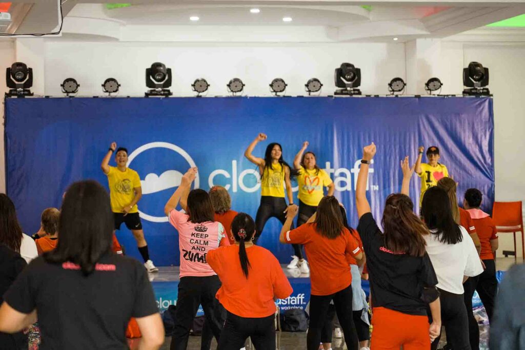 Zumba instructors and Cloudstaffers dancing