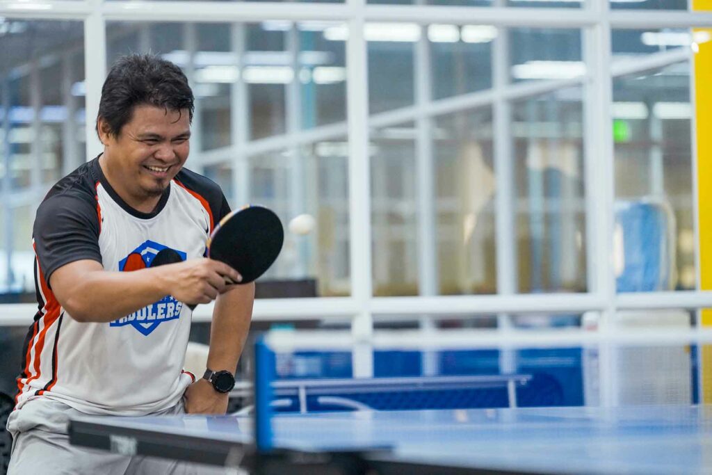 A male Cloudstaffer playing ping pong